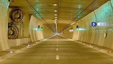Bright view of the Bosruck tunnel with ventilation and lighting 