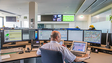 The image shows a control center dispatcher's workstation