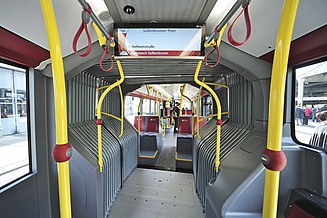The picture shows an empty bus from the inside
