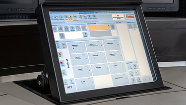 Picture of a dispatcher on a control center desk