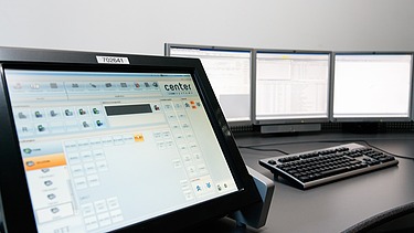 Picture of a dispatcher on a control center desk