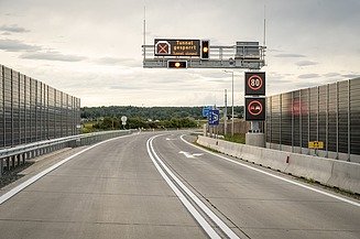 Picture with road and traffic signs