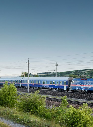 The picture shows a fast passing train