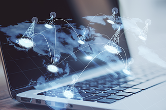 The picture shows a laptop and the schematic representation of a network