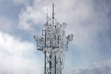 The picture shows a large transmission mast 