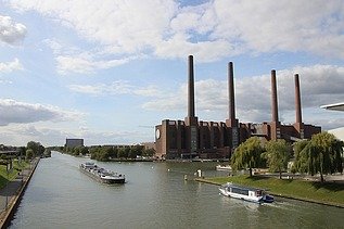 Exterior view of the VW plant in Wolfsburg, large brick factory with 4 chimneys